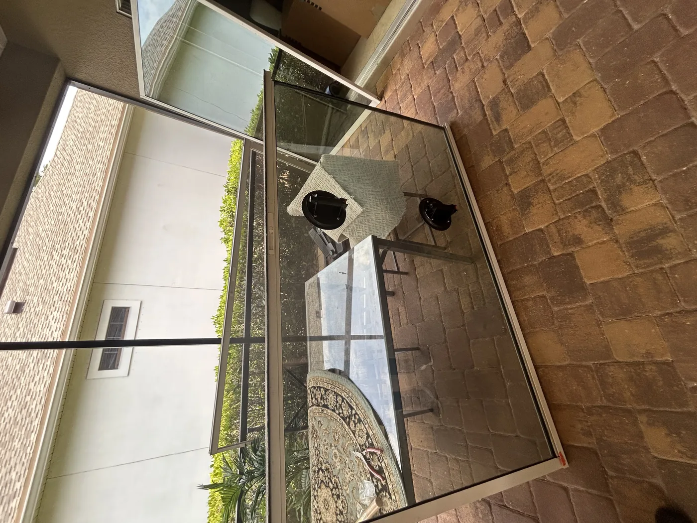 Sliding glass panel removed during an on-site coastal door repair